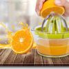 Manual Lemon Squeezer with Built-in Measuring Cup - Green